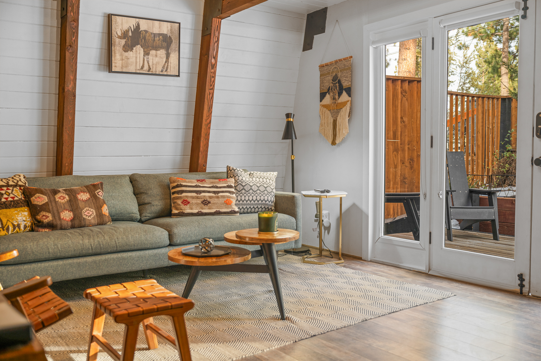 Living room with stone fireplace and French doors