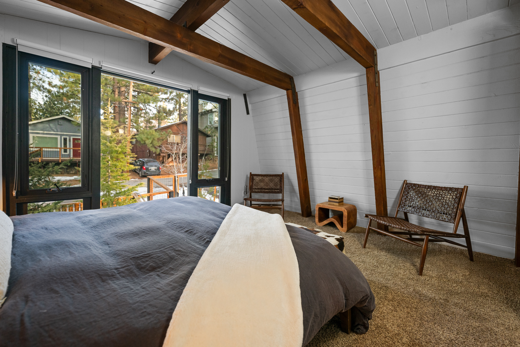 Master bedroom with exposed A-frame beams