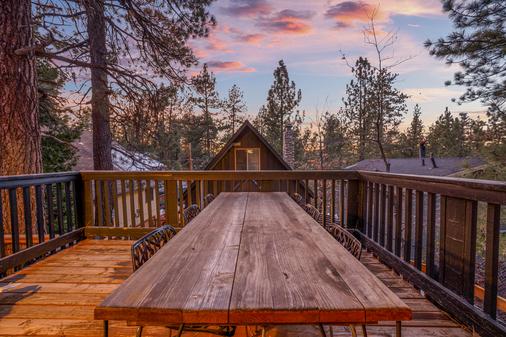 Outdoor dining on the wraparound deck at dusk